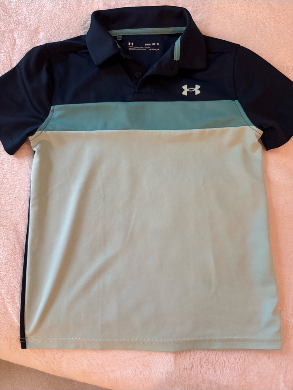 Under Armour Men's Navy and Turquoise Polo with HeatGear technology.